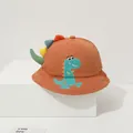 Detailed close-up of orange cotton kids bucket hat with 3D dinosaur fins and embroidery - Coffee