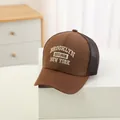 Detailed close-up of brown trucker hat with white 3D Brooklyn New York embroidery - 48-52cm / Dark Coffee