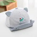 Detail of baby sun hat with cute whale embroidery, soft brim, and breathable mesh fabric - Gray/Fish Stripe