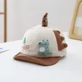 Detail of baby dinosaur baseball cap featuring 3D dinosaur doll and soft beige cotton fabric - 0-36 Months (46-48CM) / Coffee