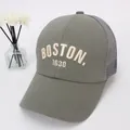 Detailed macro shot of BOSTON 1630 3D embroidery on a green breathable mesh cap - 48-52cm / BOSTON Light Green