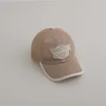 Détail du tissu en maille respirante d'une casquette enfant marron avec écusson logo - Enfants 3-10 Ans 50-54CM / Café
