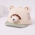 Dettaglio cappellino a rete per neonati con orsetto di peluche e ricamo Happy Baby - Bambino circa 0-36 mesi / Beige