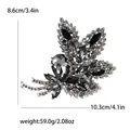 Vintage silver alloy leaf brooch with grey crystals, sized 10.3cm x 8.6cm, weighing 59g - Black