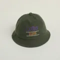 Detailed view of corduroy bucket hat featuring multicolor Colby Clark Country embroidery - 50-52CM / Army Green