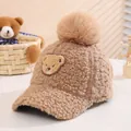 Detailed plush texture of brown kids winter baseball cap with bear patch and pom-pom - 50-54cm / Khaki