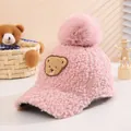 Detail of pink fleece baby baseball cap with teddy patch and large fluffy pompom ball - 50-54cm / Pink