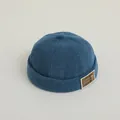 Donkerblauwe corduroy dockerhoed voor kinderen met een schattige berenpatch - Baby 50-52CM / Blauw