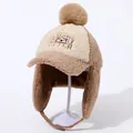 Close-up of the plush fleece winter hat with earflaps and an embroidered otter design - Khaki