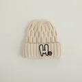 Cremefarbene Strickmütze für Kinder mit H-Patch und Smiley-Detail im umgeschlagenen Design - Kinder 2-7 Jahre / Beige