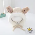 Close-up of beige plush bunny ear hat for babies with soft sherpa fleece texture - Beige
