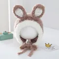 Close-up of brown plush bunny ear hat with soft faux fur texture and white crochet detail - 2-6 Years Old / Coffee