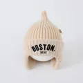 Detail of beige knit baby hat with faux fur trim and Boston embroidery on white head mold - 1-4 Years Old (Elastic) / Beige
