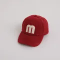 Kids warm fleece baseball cap in dark red featuring a beige M letter patch - Jujube Red