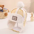 Gelbe Kinderfliegermütze mit weißem Kunstfellbesatz und weichen Ohrenklappen für den Winter - Gelb