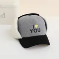 Detail of children's grey corduroy trapper hat with sheepskin earmuffs and I LOVE YOU embroidery - Kids / Gray and Black