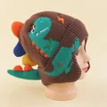 Brown knit winter hat for children featuring a 3D green dinosaur design and colorful pom-poms - 48-52cm / Coffee