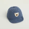 Blue corduroy baseball cap for toddlers with a white bear embroidery on a clean background - Little Bear Blue