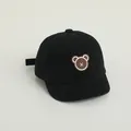 Kids black cotton baseball cap featuring a cute brown bear embroidery and short brim - Adjustable Infant Size / Black with Embroidered Bear