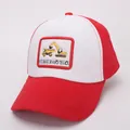 Detail of red and white trucker cap featuring embroidered yellow excavator and truck patch - Red