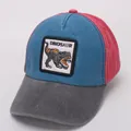 Detailed side view of a tricolor washed cotton kids baseball cap with dinosaur patch - Orange Blue Block (Dinosaur)