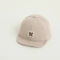 Beige corduroy baby baseball cap with K letter patch, minimalist style for toddlers - K Letter Beige