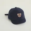 Navy blue children's baseball cap featuring a cute brown bear patch and adjustable strap - Adjustable Infant Size / Navy Blue with Embroidered Bear