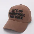 Detailed view of the 3D embroidered lettering on a brown cotton twill baseball cap - 48-54CM / Coffee