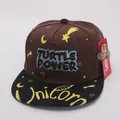 Detail view of children's baseball cap featuring Turtle Power embroidery and stars - Children 48-54cm / Coffee