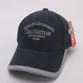 Detailed embroidery and grey contrast piping on a navy blue cotton baseball cap - 48-54CM / Navy Blue
