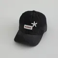 Macro detail of washed denim baseball cap with starfish embroidery and white fabric tag - Kids 3-8Y (48-53CM) / Washed Black