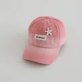 Detailed close-up of pink gradient baseball cap featuring starfish and letter patch - Kids 3-8Y (48-53CM) / Gradient Pink