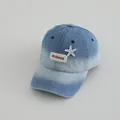 Detailed view of kids denim cap featuring blue gradient wash and white starfish decor - Kids 3-8Y (48-53CM) / Gradient Blue Denim