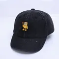 Détail de la casquette de baseball bébé en denim noir délavé avec écusson de personnage - 47-50cm / Noir