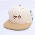 Close-up of NICE Prance embroidery on a two-tone flat brim kids baseball cap - Children's Size (Adjustable) / Off White