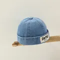 Blue denim brimless skull cap for kids featuring a vintage woven letter label patch - Style 2 Medium Denim (SHOW YM.CO)