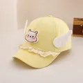 Detail of baby sun hat with cute bear embroidery, white plush wings and lace trim - Toddler Size / Yellow