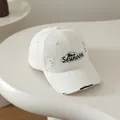 Distressed cream cotton baseball cap with Black Seunoon embroidery and frayed details - Kids 50-54CM / Off White