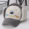 Detailed view of kids winter trapper hat featuring astronaut embroidery and fuzzy sherpa fabric - Kids (Approx. 3-10 Years) / Gray
