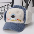 Close-up of winter child aviator hat with astronaut embroidery and blue fleece texture - Kids (Approx. 3-10 Years) / Blue