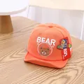 Bright orange baby baseball cap featuring a cute white BEAR and bear face embroidery - Infant 0-30 Months / Orange