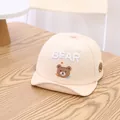 Beige baby baseball cap with soft brim featuring a cute embroidered astronaut bear design - Infant 0-30 Months / Beige