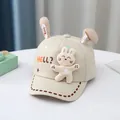 Detail of baby bunny baseball cap with 3D ears, plush rabbit, and star patterns - Toddler Size / Beige