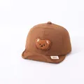 Brown infant soft-brim baseball cap featuring a cute embroidered cartoon bear patch - 0-30 Months / Coffee