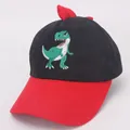 Detail of red dinosaur scales and green embroidery on a black kids' baseball cap - Kids 3-8 Years (48-54cm) / Black