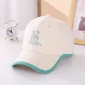 Detailed embroidery of a cute green bear and text on a beige cotton children's baseball cap - 50-54cm / Beige