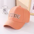 Close-up of orange baseball cap with bold KUDE embroidery and reinforced brim stitching - 50-54cm / Orange