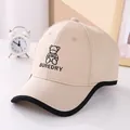 Detail of embroidered bear and BUREDRY text on beige cotton baseball cap for kids - 50-54cm / Khaki