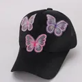 Close-up of butterfly embroidery on black mesh breathable baseball cap for kids - Trucker Hat / Black Mesh
