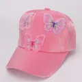 Detail of pink velvet baseball cap featuring delicate 3D mesh butterfly embroidery - Rose Red Fabric